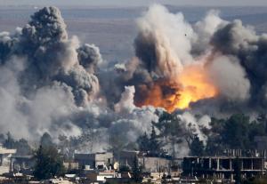 Smoke rises over Syrian town of Kobani after an airstrike, as seen from the Mursitpinar border crossing on the Turkish-Syrian border in the town of Suruc in this file October 18, 2014 file photo. 